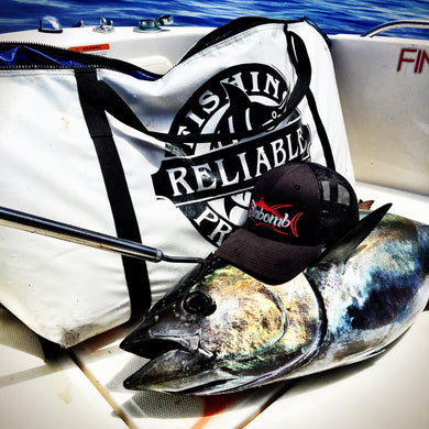 caught fish wearing a hat next to insulated fish kill bag